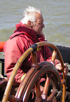 Skipper of a boat holding the wheel